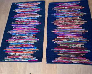 Pair of very dark blue (almost black) woven rugs with multi-color centers 46" x 30"