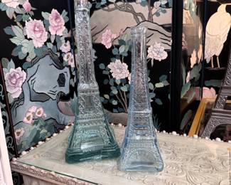 Two glass Eiffel Tower bottles, the tallest is 16"