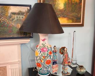 Ceramic table lamp with birds resting among flowers, shade shows some wear, black shade 34"H