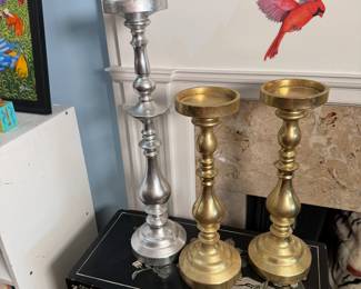 Three silver and brass finish resin votive candle holders, tallest is 18"H