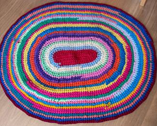 Oval rug, appears to be crocheted polyester fabric, has minor flaws 50" x 38"