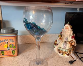 Tall wine glass vase with decorative blue stones, vase has  a few very minor chips on lip 15"