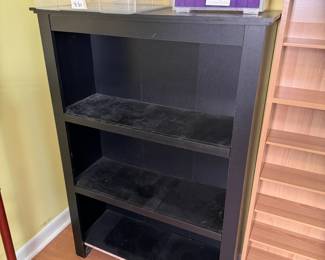 Black laminate shelf, missing the facing on the bottom shelf, 44"H x 30"W x 10"D