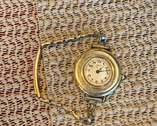 Living Room 
Case Table 
Cartier early watch