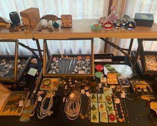 Living Room 
Case Table
Sterling jewelry, costume jewelry, whiting & Davis mesh purse in box, early jewelry, paperweights