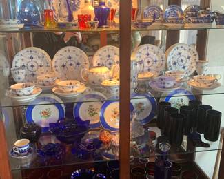 Living Room 
Royal Copenhagen Blue & White, Blenko glass pitcher, Fenton glass, Morgantown crinkle tumblers, glass paperweights, Blue Willow child’s tea set 