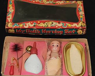 Celluloid doll and nursing set