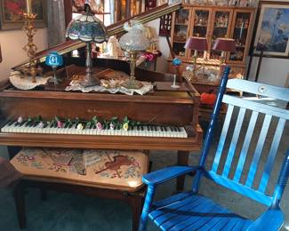 Living room - Baby Grand and rocking chair.   Yes, the chandelier is for sale