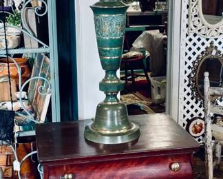 Antique chest and brass lamp