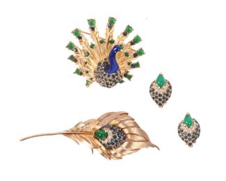 Lot 223
Marcel Boucher Moghul style vintage peacock 3pc group with green cabochons and blue rhinestones; two brooches with matching earrings