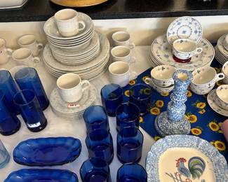 Variety of dish sets and matching glassware. 