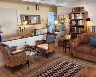 Bookcases, Lamps, Sofa, Decorations, Curtains, Books. 