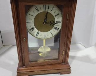 Pendulum clock handcrafted by Norman L. McDaniel, paper work states melody quartz with electric chimes (untested) 16 in. tall