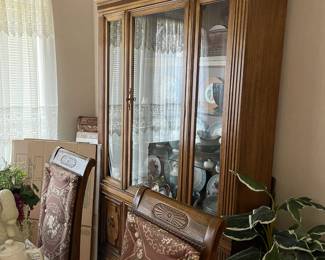 Large china cabinet that matches dining table.