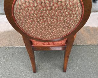 Custom upholstery detail on the back of each chair