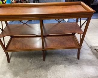 $1180. Online purchase available starting at 9 am sharp until 4pm Thursday.   Click message icon for instructions.  Scully and Scully console table with two shelves. 46”l X 15”d X 31”h.  Small (easy) repair needed to “X” detail on back right side.  This is not onsite. 