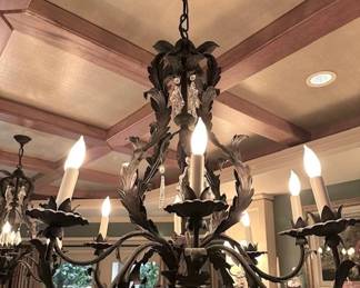 $480 each. Online purchase available starting at 9 am sharp until 4pm Thursday.  Click message icon for instructions. One of two Louis XVI style eight leaf chandelier hand wrought iron in rusty iron with cut crystal pendants. 25” dia. X 36”h. Originally $2,450 each.  Not onsite.  