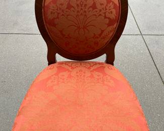 Close up of on of the side chairs.