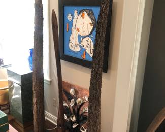 2 tall termite wood spikes about 6’ & 7’ tall. The middle piece is a wood fragment of some sort.