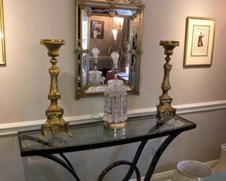 Antique brass church candlesticks, chrome and glass console table, antique Venetian mirror 