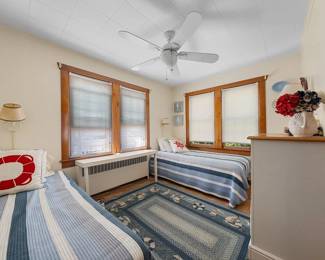 Twin beds. Ceiling fan with light