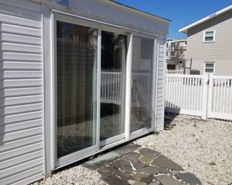 Sliding glass door with fixed panel