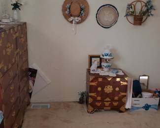 There are (2) Asian nightstands...