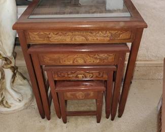 (4) Asian stack ornately carved inlaid tables with glass overlay
