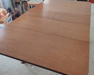 The leaves fold under the dining table