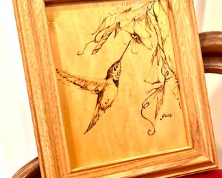 Engraved humming bird on wood, all one piece. 