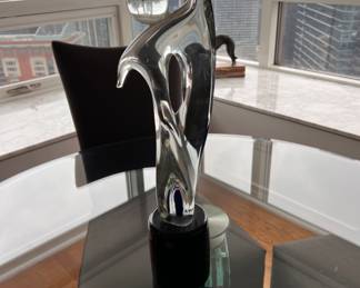 Contemporary Murano glass figure on black base.