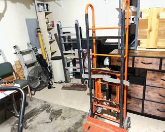 Industrial orange dolly $500 retail selling for $200.  Aluminum dolly $75. fly rod case with rod and misc. fishing tackle, poles and gear.  