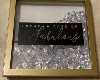 Glass plaque. Numerous loose faux gems in gold painted professional frame with black box with cutout lettering
Size: 10” H x 10” W 
