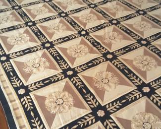 Fabulous needlepoint rug, measures 10 by 13 1/2. In beautiful shades of black ,tans & natural colors