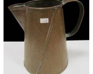 A COPPER PITCHER.  MADE FORM SHEETS WITH SOLDERED SEAMS