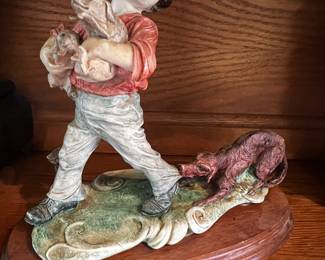 Armani boy with dogs figurine