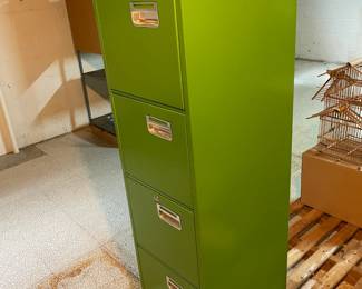 Green metal file cabinet.