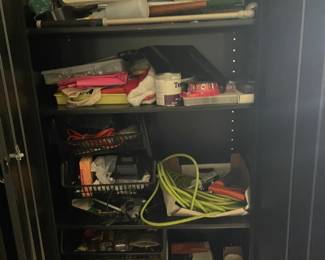 Pair of Heavy duty metal cabinets filled with tools and other items.