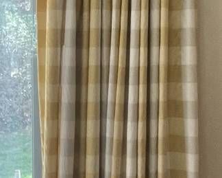 Two pairs of beige, white and yellow drapes (with hardware).