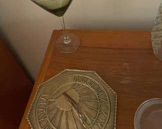 Martini glass and solid brass sundial.