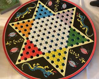 Vintage round Chinese checkers in metal container.