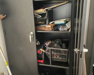 Pair of Heavy duty metal cabinets filled with tools and other items.