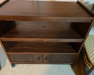 Small cabinet on rollers.