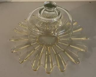 Vintage yellow amber glass bowl with ruffled edges.