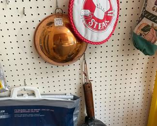 Colanders and metal trays.