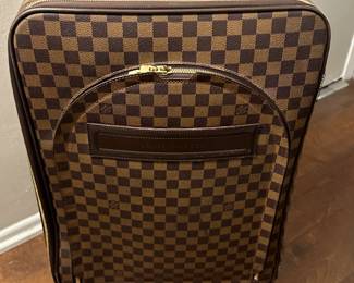 Louis Vuitton Rolling Luggage (broken wheel covers/ rubber bumers coming off)