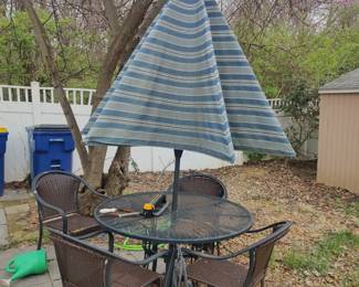 Nice wrought iron patio set/umbrella with stand
