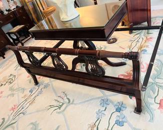 Lyre decorated footboard of antique mahogany full bed