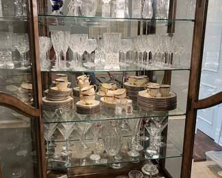 This China cabinet has many beautiful pieces, lots of Waterford Lismore, lots of crystal from other companies too. Val St. Lambert, Pier I, Lladro, and more. 