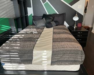 This is a full-size bed with a custom-made comforter and pillows for accessorizing